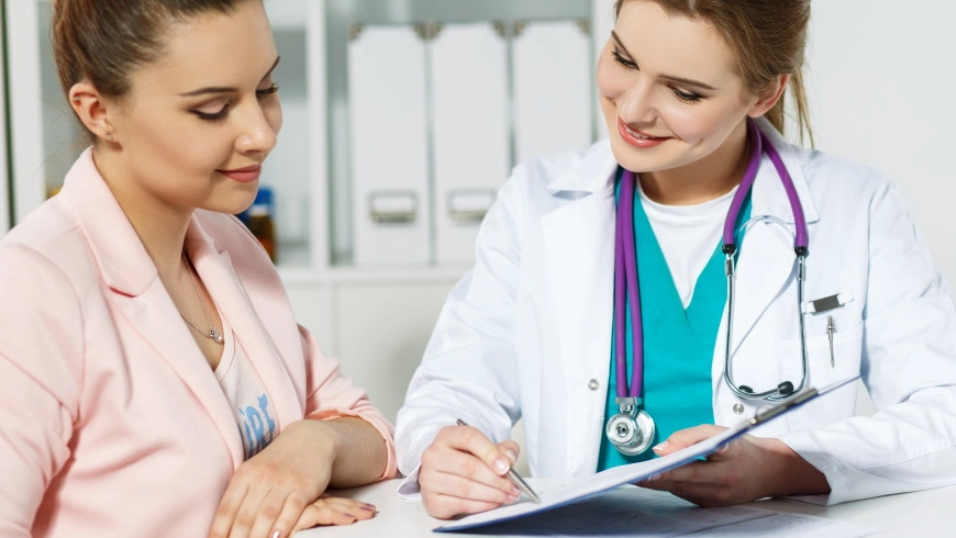 Female Doctor Discussion with Other staff on Revenue Cycle management